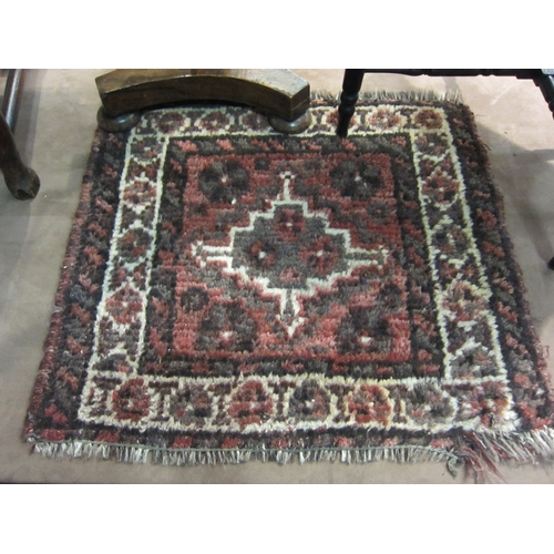 4225 - A red ground Eastern wool rug, 66cm x 61cm   (R) £15