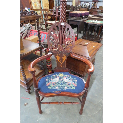 2003 - An Edwardian Arts & Crafts style inlaid mahogany open armchair, with pierced scallop shell shaped ba... 