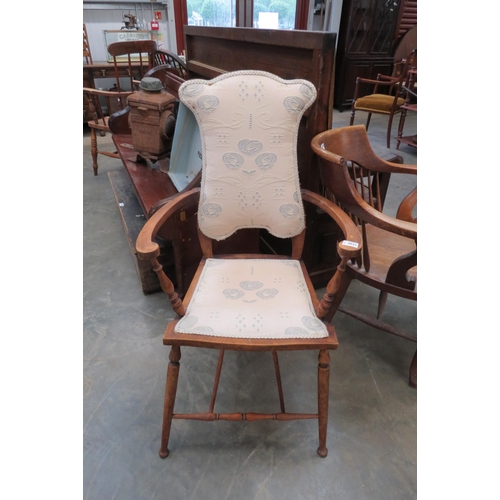 2021 - An Arts and Crafts beech framed armchair with foliate design upholstery, slender turned supports    ... 