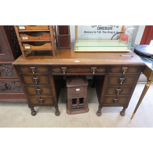 2131 - An oak leather topped twin pedestal desk