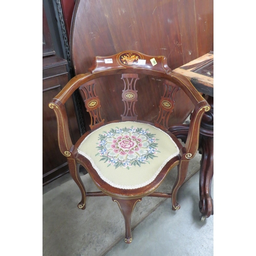 2139 - An Edwardian inlaid mahogany armchair of elaborate design    (E)  £40-60