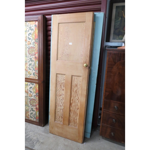 2144 - A pair of pine panelled doors with ceramic knobs and a blue painted door