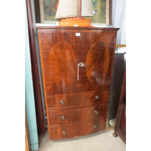 2145 - A mahogany linen cupboard on chest with trays to interior, on castors    (R)  £30