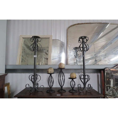 2148 - A pair of wrought iron candle sconces and three others (5)