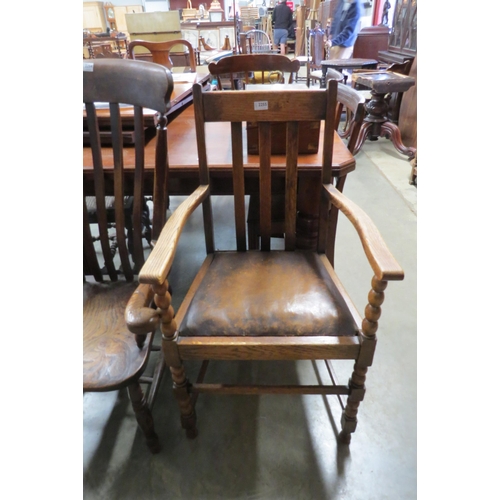 2255 - A 1930's oak dining chair with bobbin details