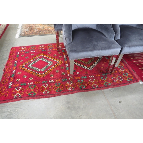 2422 - A red ground rug, 106 x 176cm and another   (R)  £30