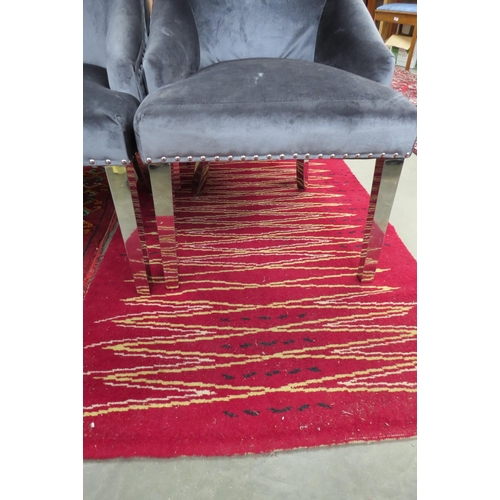 2422 - A red ground rug, 106 x 176cm and another   (R)  £30