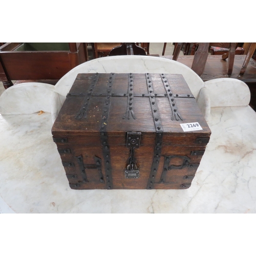 2269 - A small metal bound box with lock and key