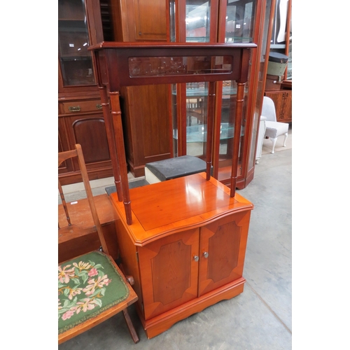 2452 - A reproduction curio cabinet and a two door modern cupboard