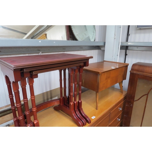 2490 - A nest of three fitting tables and a mid century sewing box