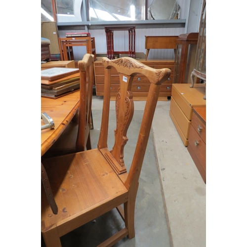 2509 - A set of four pine kitchen chairs with carved detail    (E)  £20-30