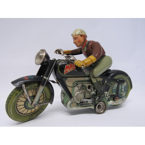 7191 - A rare Arnold Mac 700 tinplate clcokwork motorcycle and rider, made in US Zone Germany. The motorcyc... 