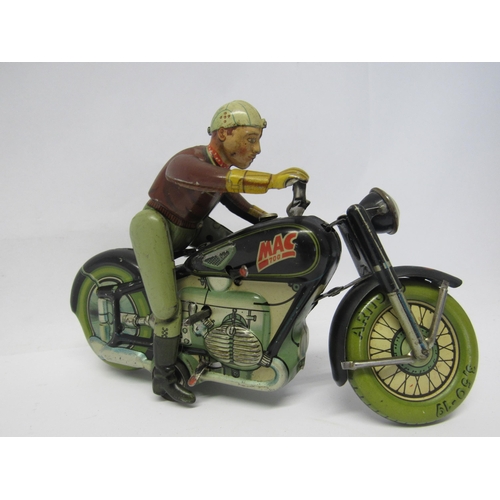 7191 - A rare Arnold Mac 700 tinplate clcokwork motorcycle and rider, made in US Zone Germany. The motorcyc... 