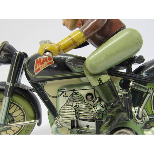 7191 - A rare Arnold Mac 700 tinplate clcokwork motorcycle and rider, made in US Zone Germany. The motorcyc... 