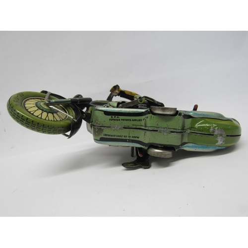 7191 - A rare Arnold Mac 700 tinplate clcokwork motorcycle and rider, made in US Zone Germany. The motorcyc... 