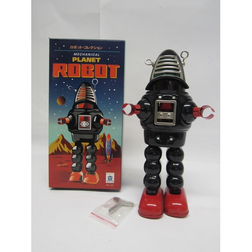 7079 - A boxed Mechanical Planet Robot clockwork tinplate robot by Ha Ha Toy, 22cm tall