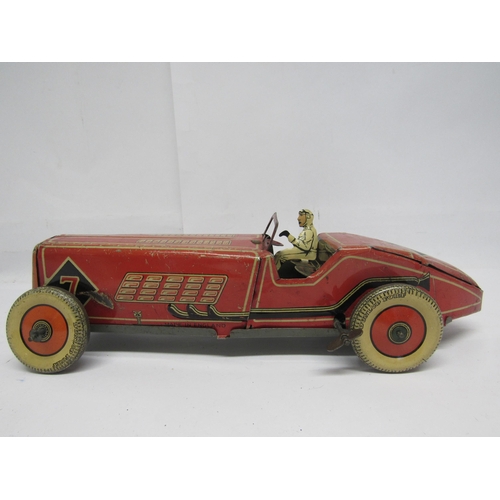 7190 - A British made clockwork tinplate racing car, probably by Mettoy, the red, cream and black car with ... 