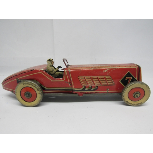 7190 - A British made clockwork tinplate racing car, probably by Mettoy, the red, cream and black car with ... 