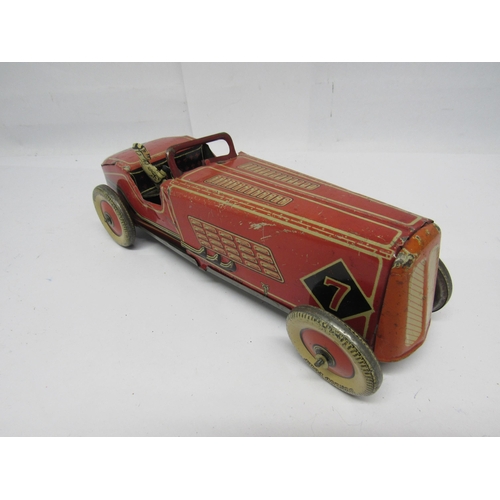 7190 - A British made clockwork tinplate racing car, probably by Mettoy, the red, cream and black car with ... 