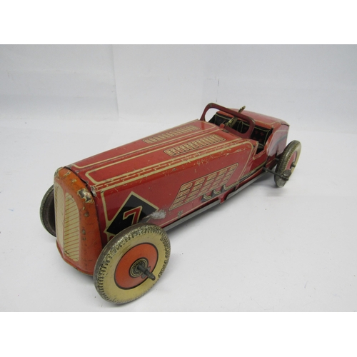 7190 - A British made clockwork tinplate racing car, probably by Mettoy, the red, cream and black car with ... 