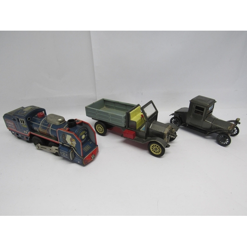 7182 - Three Japanese friction drive tinplate vehicles to include delivery truck with folding windscreen, B... 