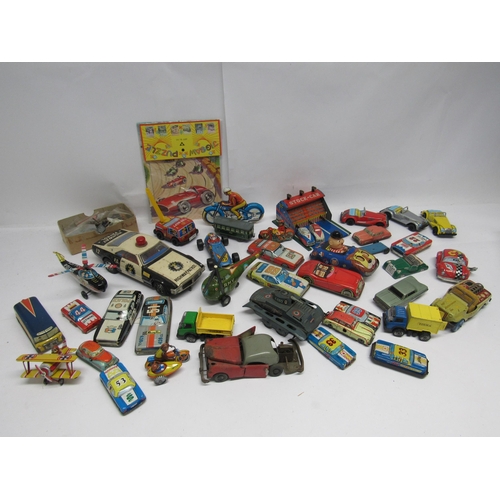 7177 - A collection of assorted Japanese, German, English and other tinplate vehicles including Arnold A-68... 