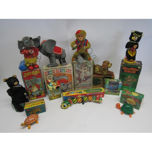 7069 - A collection of boxed Japanese tinplate, plastic and plush covered clockwork and battery operated no... 