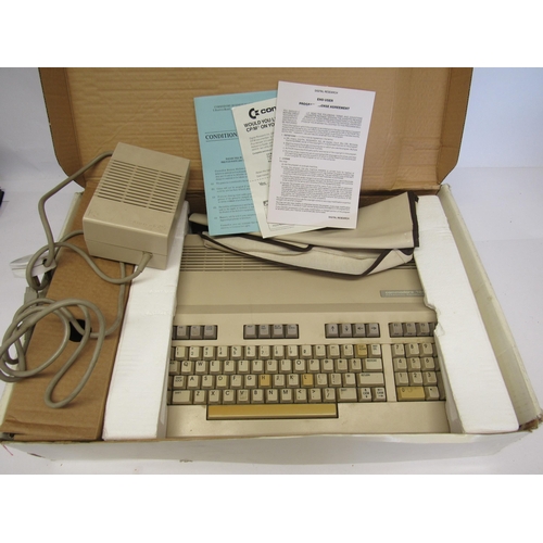 7014 - A boxed Commodore 128 Personal Computer, boxed 1530 Datasette Unit Model CJN, unboxed DPS 1101 daisy... 