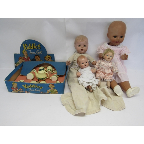 7150 - Three mid 20th Century composition dolls and a later ceramic example, together with a boxed Kiddie's... 