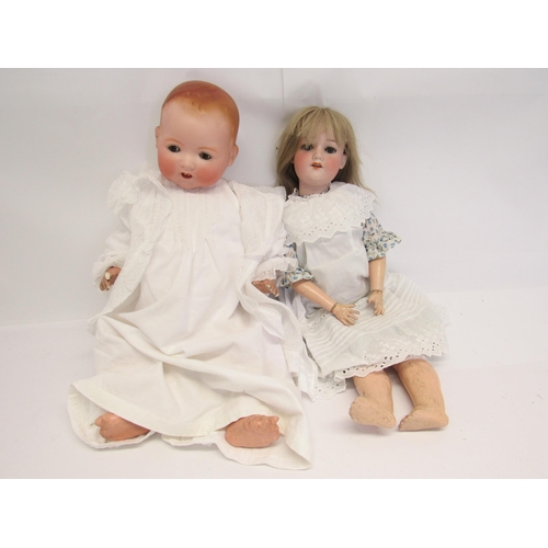 7095 - Two Armand Marseille bisque head dolls to include 390 girl doll with blonde wig, blue striated glass... 