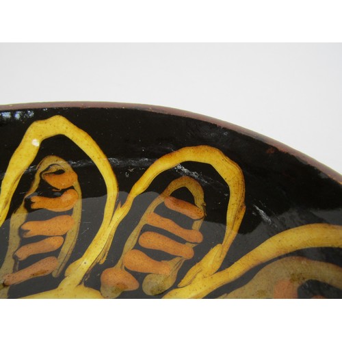 7096 - GLENYS BARTON (b.1944) A very early slipware oval dish with floral design. Signed underneath and dat... 