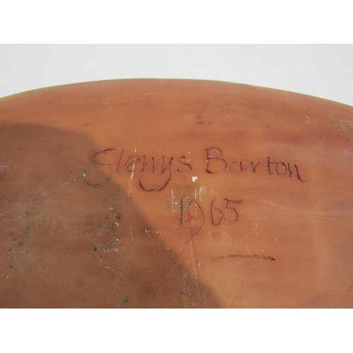 7096 - GLENYS BARTON (b.1944) A very early slipware oval dish with floral design. Signed underneath and dat... 