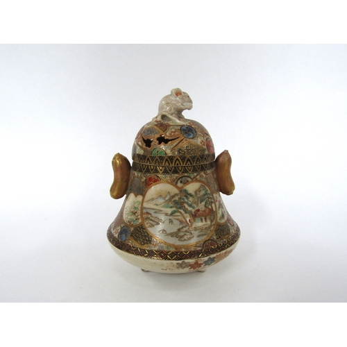 5029 - A Japanese satsuma lidded pot. The lid surmounted by a rat, the base decorated with landscape and fi... 