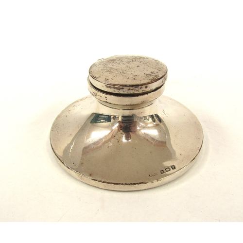 5063 - A silver Capstan inkwell, Birmingham 1920, wooden weighted base, 10.5cm diameter, makers mark rubbed... 