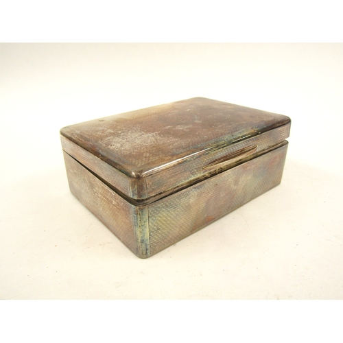 5065 - A solid silver Sampson Morden & Co cigarette box, London 1911, with inscription to the interior of t... 