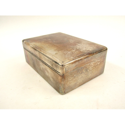 5065 - A solid silver Sampson Morden & Co cigarette box, London 1911, with inscription to the interior of t... 