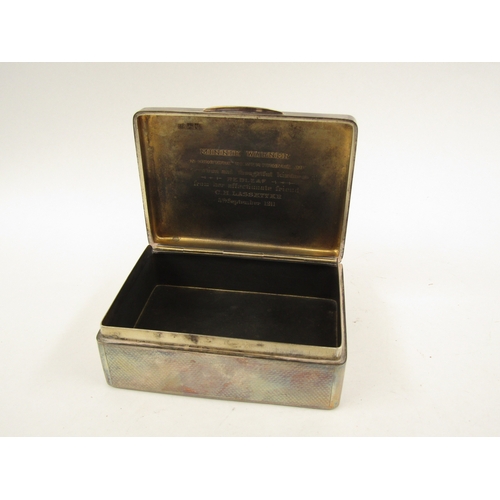 5065 - A solid silver Sampson Morden & Co cigarette box, London 1911, with inscription to the interior of t... 