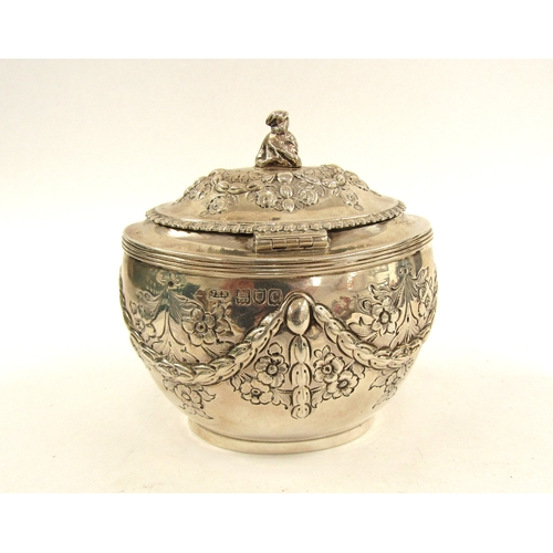 5066 - A silver John Henry Rawlings silver tea caddy, floral decorated with ribbon and swag detail, figural... 