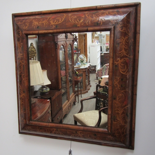 5464 - An 18th Century cushion form marquetry mirror, later mirror plate, 62cm x 58cm