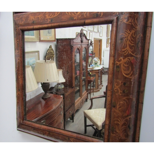 5464 - An 18th Century cushion form marquetry mirror, later mirror plate, 62cm x 58cm