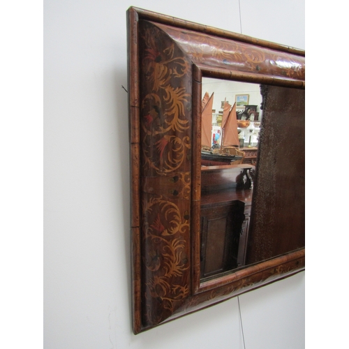 5464 - An 18th Century cushion form marquetry mirror, later mirror plate, 62cm x 58cm