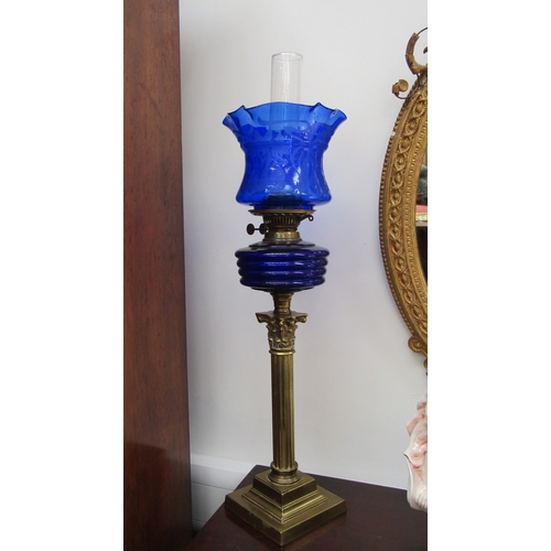 5471 - An early 20th Century English made column form oil lamp with blu art nouveau shade and ribbed blue g... 