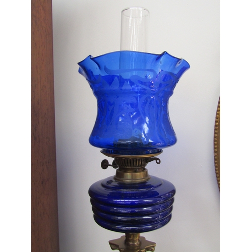 5471 - An early 20th Century English made column form oil lamp with blu art nouveau shade and ribbed blue g... 