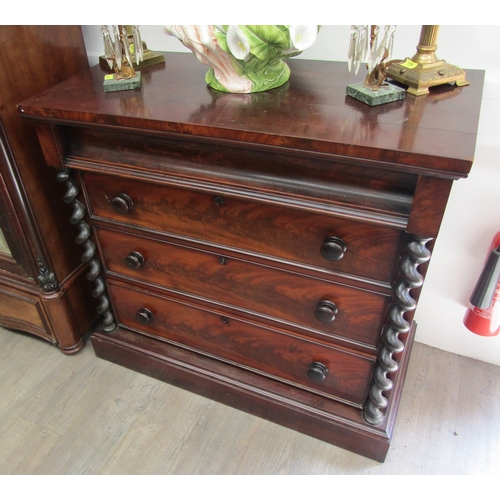 5476 - A Victorian mahogany chest of three drawers with concave cushion drawer,  barley twist coloumn detai... 