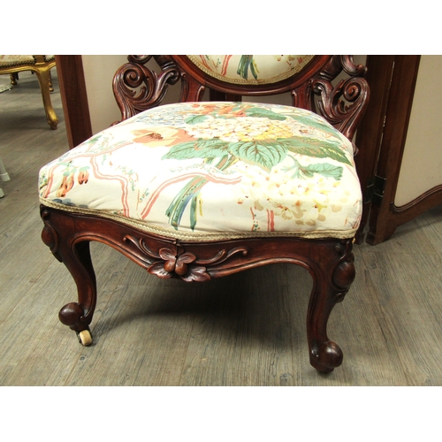 5489 - A Victorian oval back ladies open armchair with floral upholstery. Edging needs regluing. 102cm tall... 