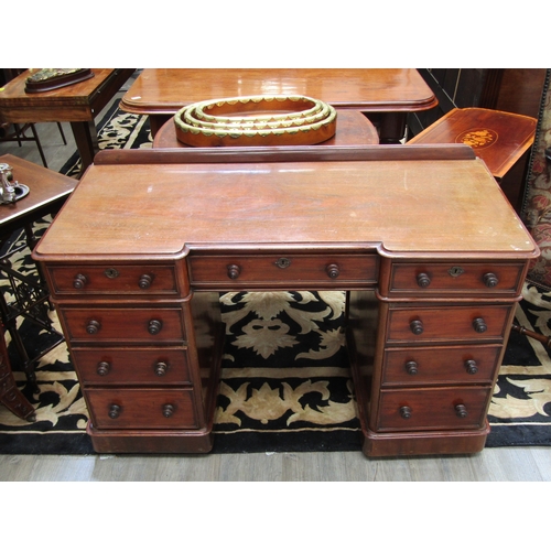 5491 - A late 19th Century mahogany breakfront twin pedestal desk of nine drawers with 1/4 gallery back, 81... 