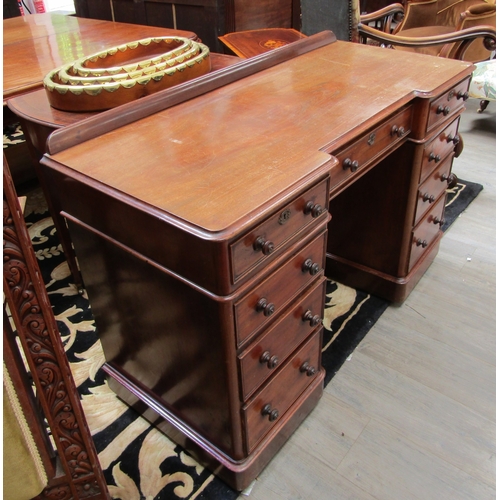 5491 - A late 19th Century mahogany breakfront twin pedestal desk of nine drawers with 1/4 gallery back, 81... 