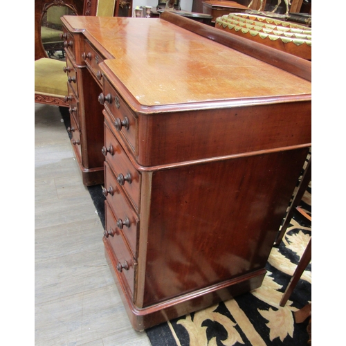 5491 - A late 19th Century mahogany breakfront twin pedestal desk of nine drawers with 1/4 gallery back, 81... 