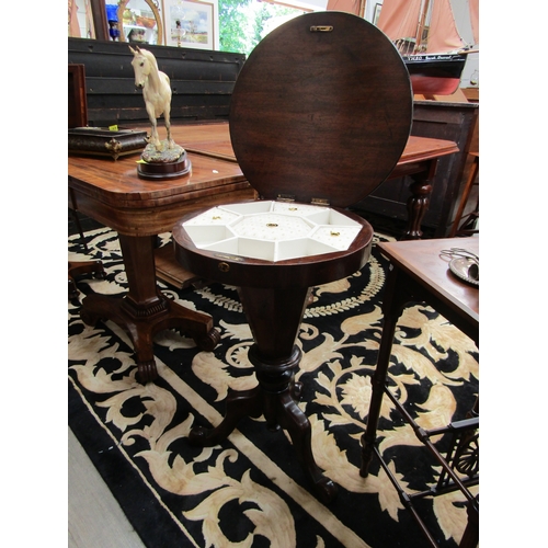 5501 - A Victorian walnut sewing table, faceted sides to tripod base