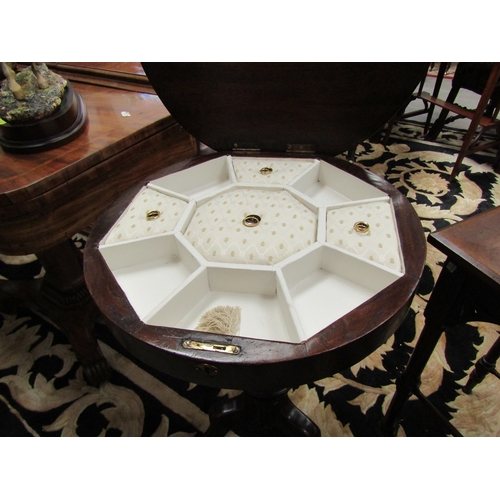 5501 - A Victorian walnut sewing table, faceted sides to tripod base